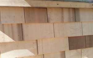 Siding a house by Gikas Painting & Contracting